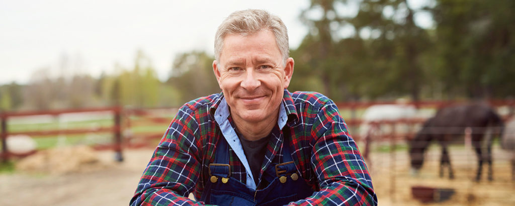 older man outside on farm