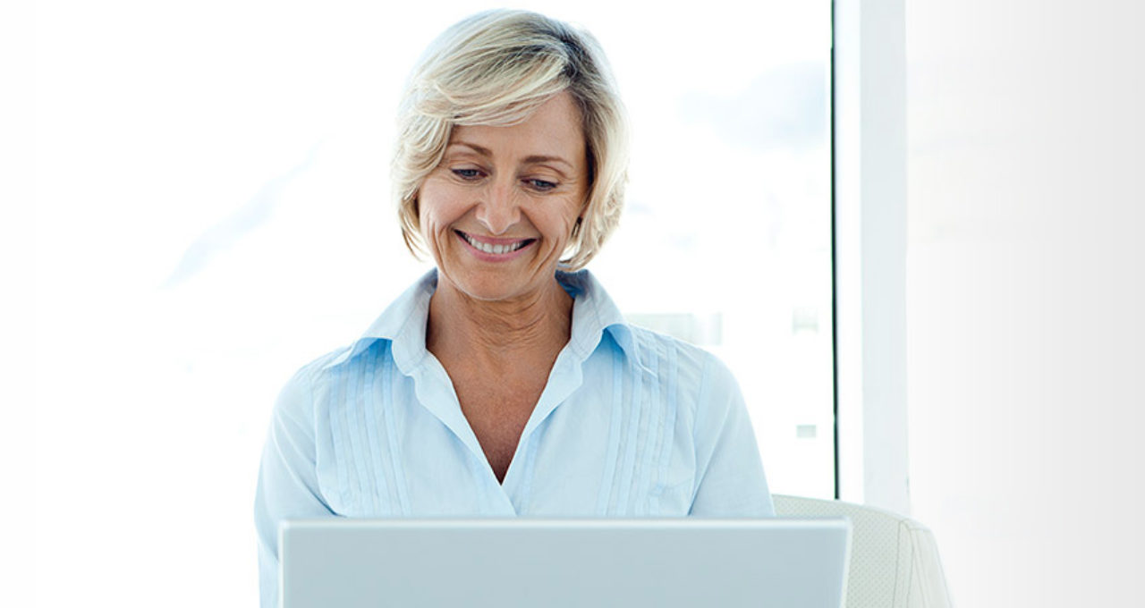 older woman using laptop