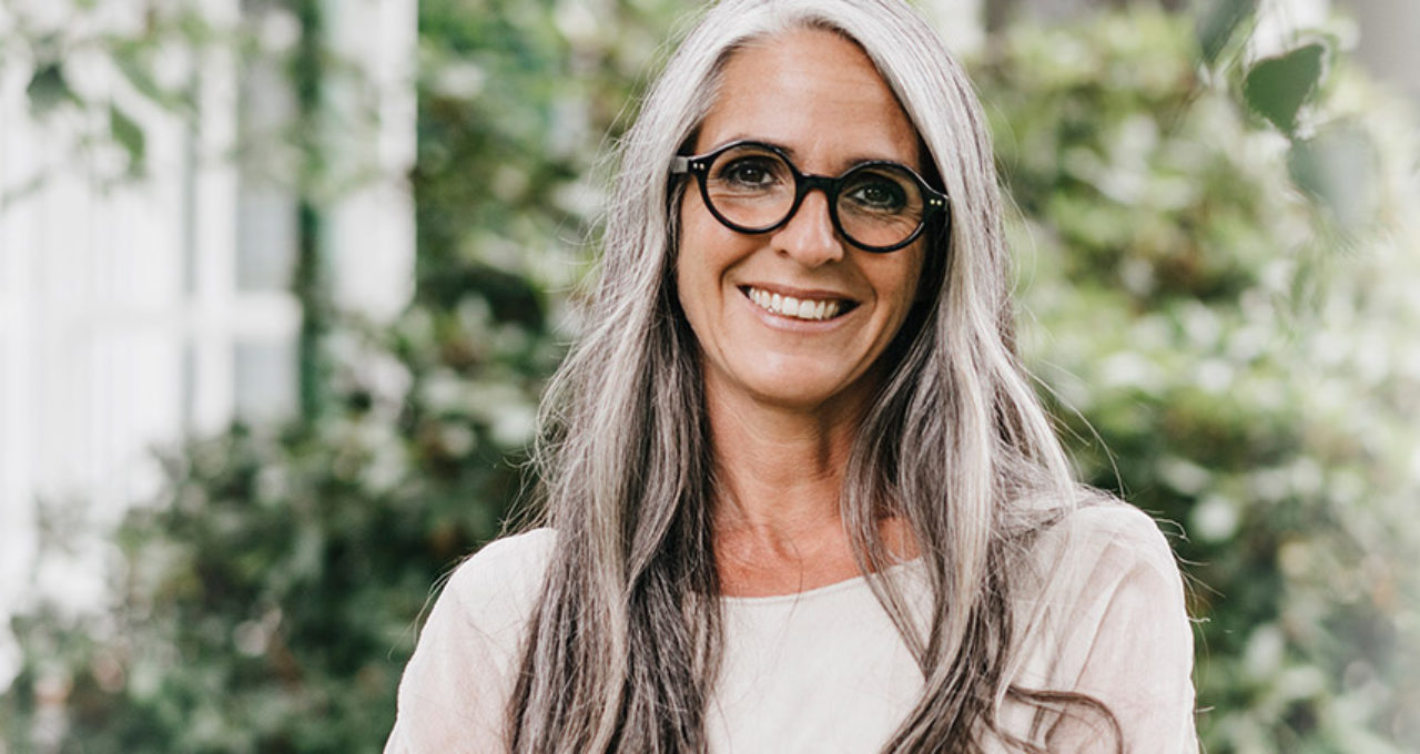 older attractive woman with glasses outside