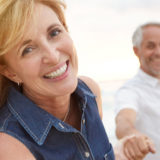 happy older couple on a beach