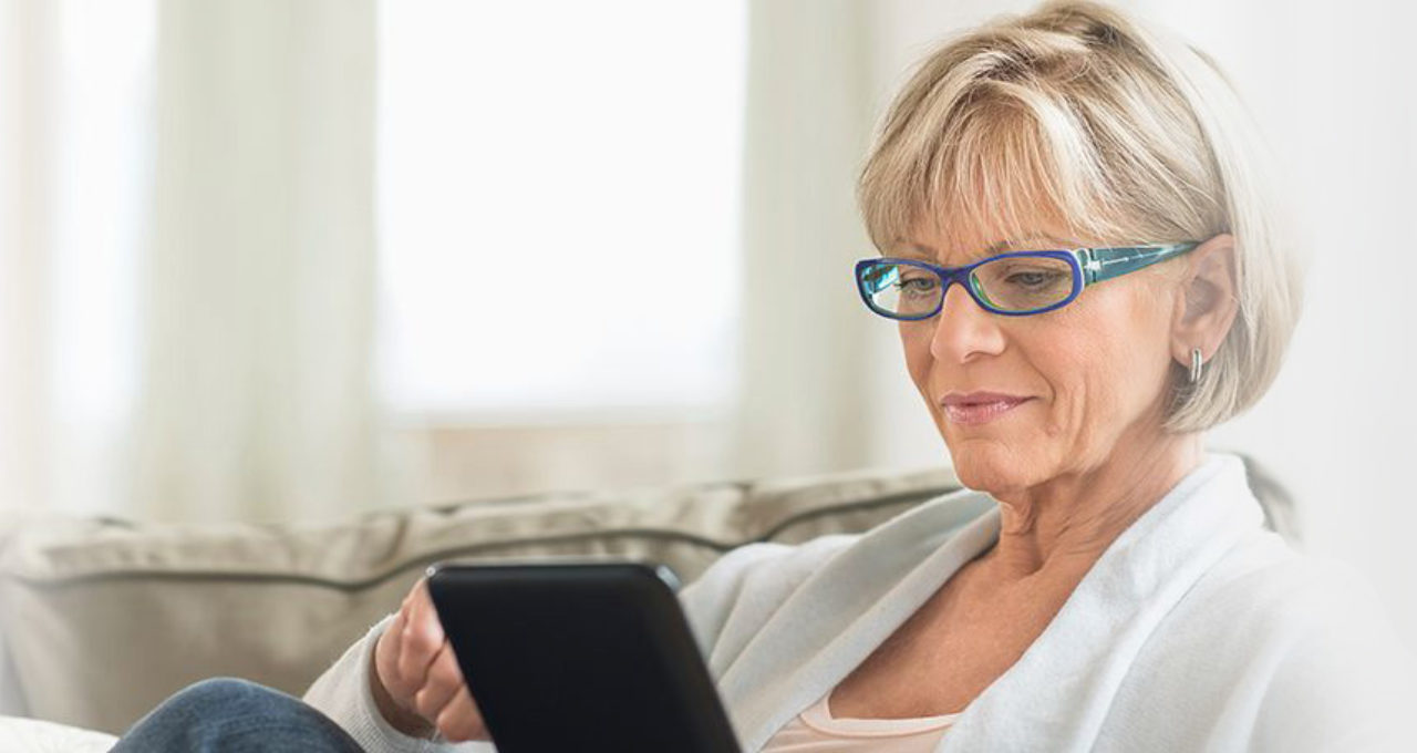 older woman on a tablet