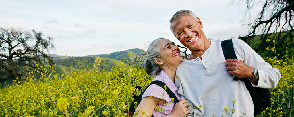 older couple hiking outside