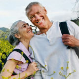 older couple outside in a field