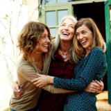 women-embracing-each-other-learning-how-to-make-friends-as-an-adult