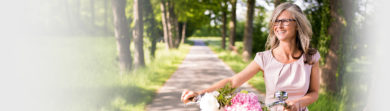 pretty older woman outside with bike